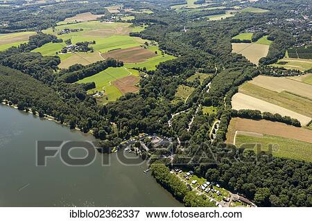 Stock Photo - "Aerial view of Haus Scheppen building on Lake Baldeneysee, Essen, Ruhr region, North Rhine-Westphalia, Germany, Europe". Fotosearch