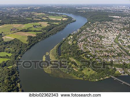 Stock Image - "Aerial view of Kupferdreh, loop of the Ruhr river, Lake Baldeneysee, Essen, Ruhr region, North Rhine-Westphalia, Germany, Europe". Fotosearch