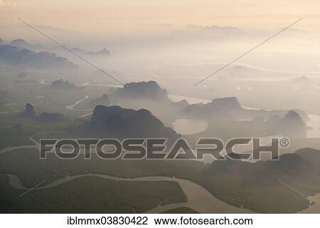 "Aerial view of Malacca Bay between the island of Phuket and the mainland of the Malay peninsula in the south of Thailand, Ao Phang Nga National Park, Phuket, Phuket Province, Thailand, Asia" View Large Photo Image Stock Image - "Aerial view of Malacca Bay between the island of Phuket and the mainland of the Malay peninsula in the south of Thailand, Ao Phang Nga National Park, Phuket, Phuket Province, Thailand, Asia". Fotosearch