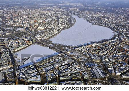 "Aerial view of the Inner Alster Lake and the Outer Alster Lake in winter, the lakes are covered with ice and snow, ice hasn't firmed up yet, central station at the front, Hamburg, Germany, Europe" View Large Photo Image Stock Image - "Aerial view of the Inner Alster Lake and the Outer Alster Lake in winter, the lakes are covered with ice and snow, ice hasn't firmed up yet, central station at the front, Hamburg, Germany, Europe". Fotosearch