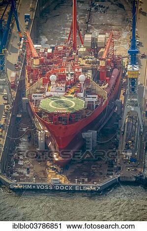 "Aerial view, oil drilling vessel anchored in the roadstead, Petrojarl Banff, Blohm + Voss shipyard, port of Hamburg, Hamburg, Germany, Europe" View Large Photo Image Stock Image - "Aerial view, oil drilling vessel anchored in the roadstead, Petrojarl Banff, Blohm + Voss shipyard, port of Hamburg, Hamburg, Germany, Europe". Fotosearch