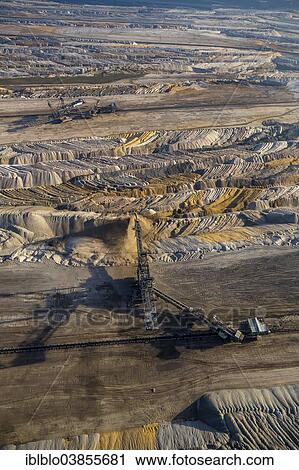 "Aerial view, open cast mine excavators in the Hambach open pit mine, earth fills, Niederzier, Julich-Zulpicher Borde region, North Rhine-Westphalia, Germany, Europe" View Large Photo Image Stock Image - "Aerial view, open cast mine excavators in the Hambach open pit mine, earth fills, Niederzier, Julich-Zulpicher Borde region, North Rhine-Westphalia, Germany, Europe". Fotosearch