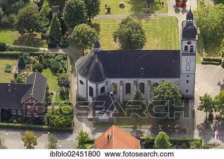 Stock Image - "Aerial view, Parish Church of St. Vitus, Sankt Vit, Rheda-Wiedenbrueck, North Rhine-Westphalia, Germany, Europe". Fotosearch
