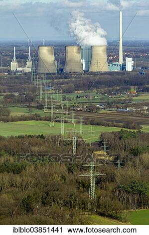 Stock Image - "Aerial view, power lines with the Gersteinwerk coal-fired power plant at the back, Hamm, Ruhr area, North Rhine-Westphalia, Germany, Europe". Fotosearch