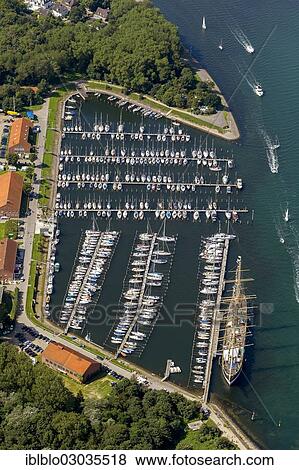 "Aerial view, Priwall Baltic Sea Station, yacht harbour, Seglermesse restaurant, Lubeck-Travemunde, Travemunde, Lubeck, Schleswig-Holstein, Germany, Europe" View Large Photo Image Stock Photo - "Aerial view, Priwall Baltic Sea Station, yacht harbour, Seglermesse restaurant, Lubeck-Travemunde, Travemunde, Lubeck, Schleswig-Holstein, Germany, Europe". Fotosearch