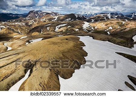 "Aerial view, rhyolite mountains partially covered with snow, Landmannalaugar, Fjallabak conservation area, Icelandic Highlands, Iceland, Europe" View Large Photo Image Stock Photo - "Aerial view, rhyolite mountains partially covered with snow, Landmannalaugar, Fjallabak conservation area, Icelandic Highlands, Iceland, Europe". Fotosearch