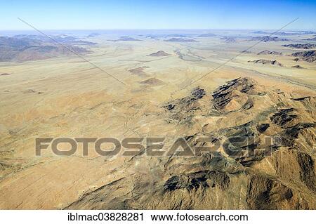 "Aerial view, rugged landscape between Khomas Hochland and the Namib Desert, Namibia, Africa" View Large Photo Image Stock Image - "Aerial view, rugged landscape between Khomas Hochland and the Namib Desert, Namibia, Africa". Fotosearch