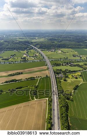 "Aerial view, Ruhrtalbrucke bridge, A52 motorway, Ruhr river, Ruhrtal, Ruhr Valley, between Mulheim and Essen, Ruhr Area, North Rhine-Westphalia, Germany, Europe" View Large Photo Image Stock Image - "Aerial view, Ruhrtalbrucke bridge, A52 motorway, Ruhr river, Ruhrtal, Ruhr Valley, between Mulheim and Essen, Ruhr Area, North Rhine-Westphalia, Germany, Europe". Fotosearch