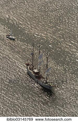 Stock Photo - "Aerial view, sailboats during the Hanse Sail Rostock, Warnemunde, Rostock, Mecklenburg-Western Pomerania, Germany, Europe". Fotosearch