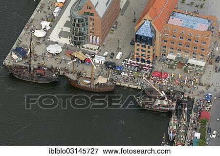 Stock Photo - "Aerial view, sailing boats in the Museum Harbour during the """"Hanse Sail"""" festival, Mitte, Berlin, Berlin, Germany, Europe". Fotosearch