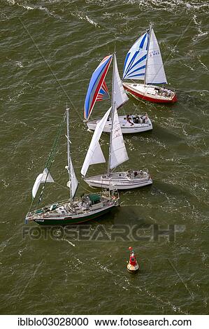 "Aerial view, sailing regatta in the Bay of Greifswald or Greifswald Bodden, sailboats, turn buoy, Middelhagen off the island of Ruegen, Alt Reddevitz, Middelhagen, Rugen, Mecklenburg-Western Pomerania, Germany, Europe" View Large Photo Image Stock Image - "Aerial view, sailing regatta in the Bay of Greifswald or Greifswald Bodden, sailboats, turn buoy, Middelhagen off the island of Ruegen, Alt Reddevitz, Middelhagen, Rugen, Mecklenburg-Western Pomerania, Germany, Europe". Fotosearch