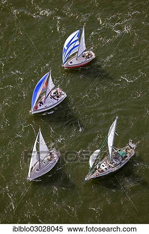 "Aerial view, sailing regatta in the Bay of Greifswald or Greifswald Bodden, sailboats, turn buoy, Middelhagen off the island of Ruegen, Alt Reddevitz, Middelhagen, Rugen, Mecklenburg-Western Pomerania, Germany, Europe" View Large Photo Image Stock Photography - "Aerial view, sailing regatta in the Bay of Greifswald or Greifswald Bodden, sailboats, turn buoy, Middelhagen off the island of Ruegen, Alt Reddevitz, Middelhagen, Rugen, Mecklenburg-Western Pomerania, Germany, Europe". Fotosearch