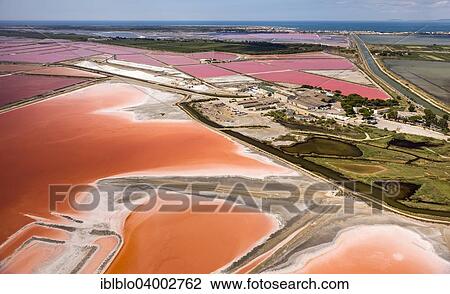 "Aerial view, salt pans, red salt marshes for salt production, Aigues-Mortes, Camargue, Languedoc-Roussillon, South of France, France, Europe" View Large Photo Image Stock Image - "Aerial view, salt pans, red salt marshes for salt production, Aigues-Mortes, Camargue, Languedoc-Roussillon, South of France, France, Europe". Fotosearch