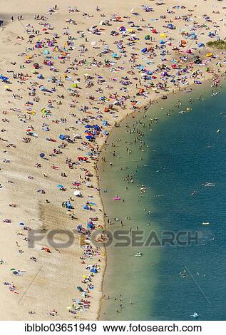 "Aerial view, sandy beach at Silbersee II lake with people swimming and sunbathing, Sythen, Haltern am See, North Rhine-Westphalia, Germany, Europe" View Large Photo Image Stock Photo - "Aerial view, sandy beach at Silbersee II lake with people swimming and sunbathing, Sythen, Haltern am See, North Rhine-Westphalia, Germany, Europe". Fotosearch