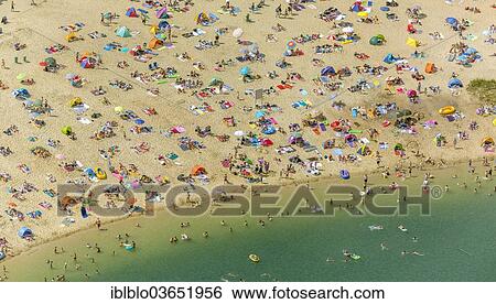 Stock Photograph - "Aerial view, sandy beach at Silbersee II lake with people swimming and sunbathing, Sythen, Haltern am See, North Rhine-Westphalia, Germany, Europe". Fotosearch