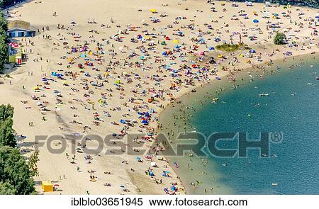 "Aerial view, sandy beach at Silbersee II lake with people swimming and sunbathing, Lehmbraken, Haltern am See, North Rhine-Westphalia, Germany, Europe" View Large Photo Image Stock Photography - "Aerial view, sandy beach at Silbersee II lake with people swimming and sunbathing, Lehmbraken, Haltern am See, North Rhine-Westphalia, Germany, Europe". Fotosearch