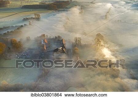Picture - "Aerial view, Schloss Oberwerries moated castle, morning fog over the Lippe river, Hamm, Ruhr area, North Rhine-Westphalia, Germany, Europe". Fotosearch