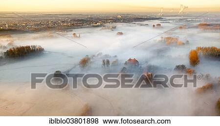 Stock Photo - "Aerial view, Schloss Oberwerries moated castle, morning mist above the Lippe river, Lippeauen, Hamm, Ruhr area, North Rhine-Westphalia, Germany, Europe". Fotosearch
