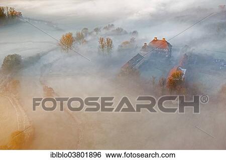 Stock Photograph - "Aerial view, Schloss Oberwerries moated castle, morning mist above the Lippe river, Lippeauen, Hamm, Ruhr area, North Rhine-Westphalia, Germany, Europe". Fotosearch