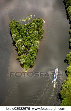 "Aerial view, small heart-shaped island where the Ruhr River joins the Kemnade reservoir, with passenger ship """"Schwalbe"""", Witten, Ruhr Area, North Rhine-Westphalia, Germany, Europe" View Large Photo Image Stock Photography - "Aerial view, small heart-shaped island where the Ruhr River joins the Kemnade reservoir, with passenger ship """"Schwalbe"""", Witten, Ruhr Area, North Rhine-Westphalia, Germany, Europe". Fotosearch