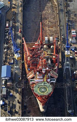 "Aerial view, specialized ship, Petrojarl Banff, being overhauled at the Blohm & Voss shipyard in Elbe 17, Hamburg, Hamburg, Hamburg, Germany, Europe" View Large Photo Image Stock Image - "Aerial view, specialized ship, Petrojarl Banff, being overhauled at the Blohm & Voss shipyard in Elbe 17, Hamburg, Hamburg, Hamburg, Germany, Europe". Fotosearch