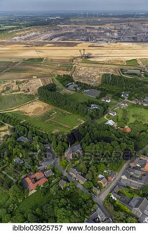 "Aerial view, St. Martinus parish church, Borschmich district, abandoned district of Erkelenz on the edge of the Garzweiler surface mine, Lower Rhine, North Rhine-Westphalia, Germany, Europe" View Large Photo Image Stock Photo - "Aerial view, St. Martinus parish church, Borschmich district, abandoned district of Erkelenz on the edge of the Garzweiler surface mine, Lower Rhine, North Rhine-Westphalia, Germany, Europe". Fotosearch