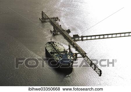 "Aerial view, tanker loading at the marine loading arms of the Northwest oil line, Wilhelmshaven, Lower Saxony, Germany, Europe" View Large Photo Image Stock Photo - "Aerial view, tanker loading at the marine loading arms of the Northwest oil line, Wilhelmshaven, Lower Saxony, Germany, Europe". Fotosearch