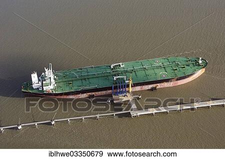 Stock Photo - "Aerial view, tanker loading at the marine loading arms of the Northwest oil line, Wilhelmshaven, Lower Saxony, Germany, Europe". Fotosearch