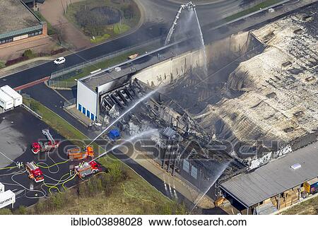 Stock Photo - "Aerial view, the fire brigade fighting a major fire destroying a factory building of WKW Automotive, a company processing aluminium, Sprockhovel, Ruhr district, North Rhine-Westphalia, Germany, Europe". Fotosearch