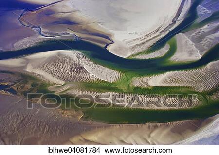 "Aerial view, tidal creeks and sand dunes in the Wadden Sea of the North Sea at low tide, Hallig Hooge, Schleswig-Holstein, Germany, Europe" View Large Photo Image Picture - "Aerial view, tidal creeks and sand dunes in the Wadden Sea of the North Sea at low tide, Hallig Hooge, Schleswig-Holstein, Germany, Europe". Fotosearch