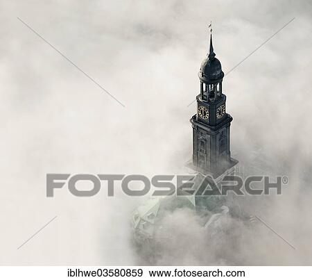 Stock Photo - "Aerial view, tower of the church of St. Michaelis or """"Michel"""" in the fog, Hamburg, Hamburg, Germany, Europe". Fotosearch