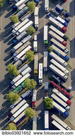 "Aerial view, trucks on Schwerte-Sud rest area on the A1 motorway, lorry parking, Schwerte, Ruhr district, North Rhine-Westphalia, Germany, Europe" View Large Photo Image Stock Image - "Aerial view, trucks on Schwerte-Sud rest area on the A1 motorway, lorry parking, Schwerte, Ruhr district, North Rhine-Westphalia, Germany, Europe". Fotosearch