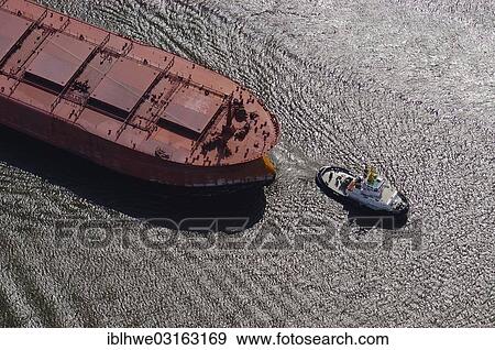 "Aerial view, tug with the boat """"Saar N"""" in tow, Hamburg, Hamburg, Germany, Europe" View Large Photo Image Stock Photo - "Aerial view, tug with the boat """"Saar N"""" in tow, Hamburg, Hamburg, Germany, Europe". Fotosearch