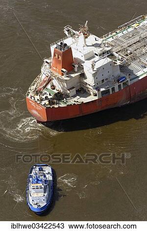 "Aerial view, tugboat pulling a tanker in the port, Hamburg, Hamburg, Germany, Europe" View Large Photo Image Stock Image - "Aerial view, tugboat pulling a tanker in the port, Hamburg, Hamburg, Germany, Europe". Fotosearch