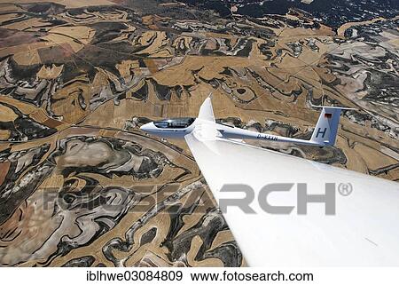 "Aerial view, type ASH 26 E glider fkying over the Castillian countryside, Segovia, Castile and Leon, Spain, Europe" View Large Photo Image Stock Photo - "Aerial view, type ASH 26 E glider fkying over the Castillian countryside, Segovia, Castile and Leon, Spain, Europe". Fotosearch