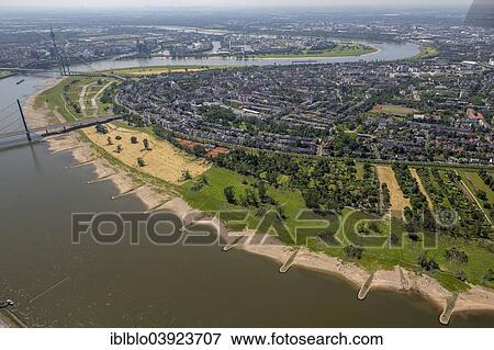 "Aerial view, uprooted trees between Oberkassel Bridge and Rheinkniebrucke bridge on the banks of the Rhine, storm damage caused on 9 June 2014, Dusseldorf, Rhineland, North Rhine-Westphalia, Germany, Europe" View Large Photo Image Stock Photo - "Aerial view, uprooted trees between Oberkassel Bridge and Rheinkniebrucke bridge on the banks of the Rhine, storm damage caused on 9 June 2014, Dusseldorf, Rhineland, North Rhine-Westphalia, Germany, Europe". Fotosearch
