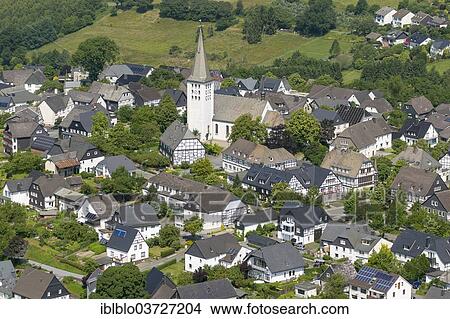"Aerial view, village of Hirschberg with the parish church of St. Christopher, Hirschberg, Warstein, North Rhine-Westphalia, Germany, Europe" View Large Photo Image Picture - "Aerial view, village of Hirschberg with the parish church of St. Christopher, Hirschberg, Warstein, North Rhine-Westphalia, Germany, Europe". Fotosearch
