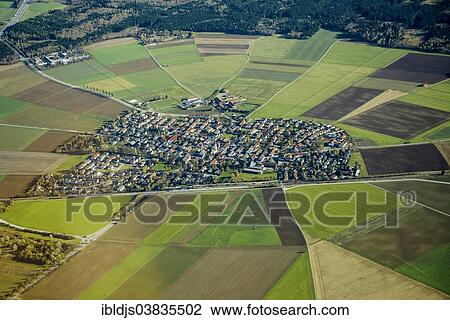 Stock Image - "Aerial view, village with fields and meadows, Aying, Bavaria, Upper Bavaria, Germany, Europe". Fotosearch