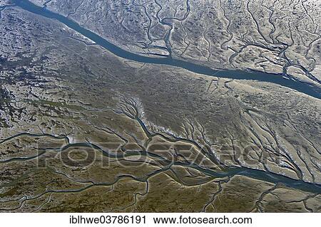 "Aerial view, Wadden Sea in winter, tidal creeks at low tide, Marne, Schleswig-Holstein, Germany, Europe" View Large Photo Image Stock Image - "Aerial view, Wadden Sea in winter, tidal creeks at low tide, Marne, Schleswig-Holstein, Germany, Europe". Fotosearch