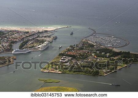 "Aerial view, Warnemuende cruise ship docks, Am Passagierkai quay, mouth of the Warnow River, Warnemunde, Rostock, Mecklenburg-Western Pomerania, Germany, Europe" View Large Photo Image Stock Image - "Aerial view, Warnemuende cruise ship docks, Am Passagierkai quay, mouth of the Warnow River, Warnemunde, Rostock, Mecklenburg-Western Pomerania, Germany, Europe". Fotosearch