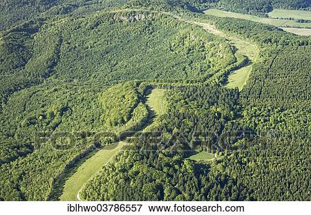 Stock Photo - "Aerial view, wide swath through forest terrain, former inner German border, today border of Thuringia and Hesse, German Green Belt nature protection initiative, Volkerode, Eichsfeld, Thuringia, Germany, Europe". Fotosearch