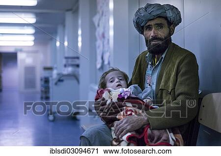 "Afghan man with a child awaiting treatment in the field hospital of PRT Feyzabad operated by the German Army, Feyzabad, Feyzabad, Badakhshan, Afghanistan, Asia" View Large Photo Image Stock Image - "Afghan man with a child awaiting treatment in the field hospital of PRT Feyzabad operated by the German Army, Feyzabad, Feyzabad, Badakhshan, Afghanistan, Asia". Fotosearch
