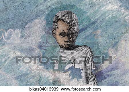 Stock Photo - "African child, refugee, mural, street art, Dusseldorf, North Rhine-Westphalia, Germany, Europe". Fotosearch