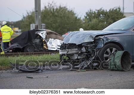 "After a head-on collision a Peugeot car landed on the light railway tracks and caught fire, the driver burnt inside the wreckage, at front, heavily damaged Audi A4, Ostfildern, Baden-Wuerttemberg, Germany, Europe" View Large Photo Image Stock Image - "After a head-on collision a Peugeot car landed on the light railway tracks and caught fire, the driver burnt inside the wreckage, at front, heavily damaged Audi A4, Ostfildern, Baden-Wuerttemberg, Germany, Europe". Fotosearch