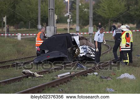 "After a head-on collision a Peugeot car landed on the light railway tracks and caught fire, the driver burnt inside the wreckage, Ostfildern, Baden-Wuerttemberg, Germany, Europe" View Large Photo Image Stock Photograph - "After a head-on collision a Peugeot car landed on the light railway tracks and caught fire, the driver burnt inside the wreckage, Ostfildern, Baden-Wuerttemberg, Germany, Europe". Fotosearch