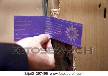 "After the completion of the gathering of forensic evidence, a broken in apartment door is closed with a police seal, officer of the C. I. D., the Criminal Investigation Department, working at the scene of a crime, re-enacted scene" View Large Photo Image Stock Photography - "After the completion of the gathering of forensic evidence, a broken in apartment door is closed with a police seal, officer of the C. I. D., the Criminal Investigation Department, working at the scene of a crime, re-enacted scene". Fotosearch