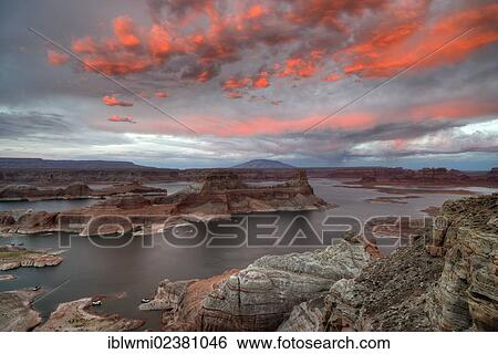 Stock Photograph - "Afterglow, view from Alstrom Point to Lake Powell illuminated by clouds after sunset, Padre Bay with Gunsight Butte and Navajo Mountain, houseboats, Bigwater, Glen Canyon National Recreation Area, Arizona, Southwestern USA, Utah, USA". Fotosearch