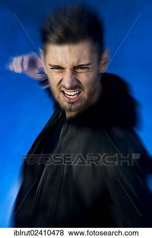 Aggressive young man with his hand prepared to strike View Large Photo Image Stock Photo - Aggressive young man with his hand prepared to strike. Fotosearch