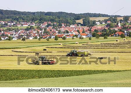 Stock Image - "Agricultural machines working in the fields, Honau, Baden-Wuerttemberg, Germany, Europe, PublicGround, Europe". Fotosearch
