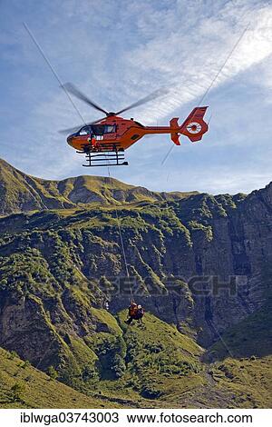 Stock Image - "Air rescue, rescue exercise, Eurocopter EC 115 helicopter, Oytal Valley, Allgau Alps, Allgau, Bavaria, Germany, Europe". Fotosearch